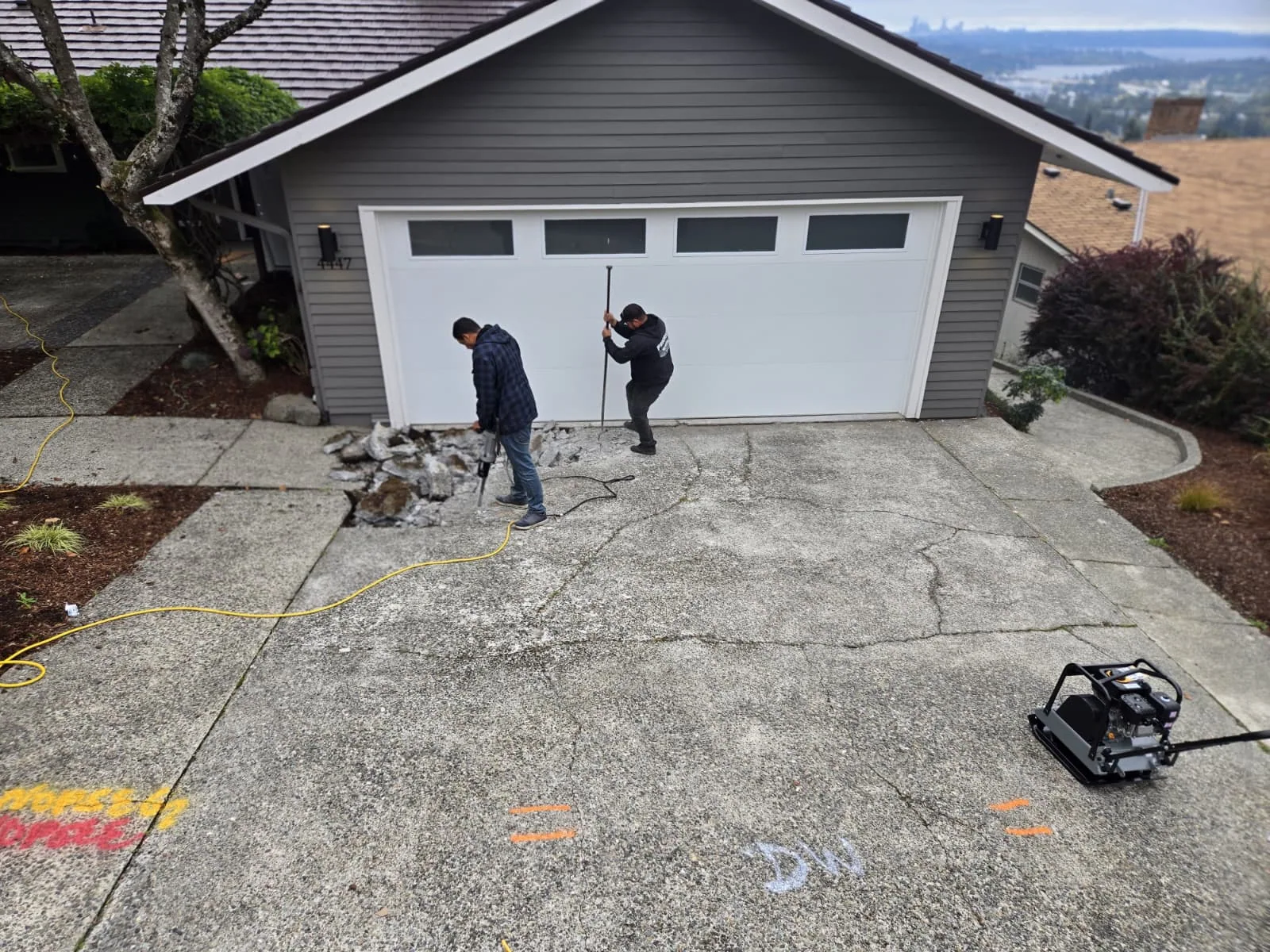 Cracked concrete driveway before renovation